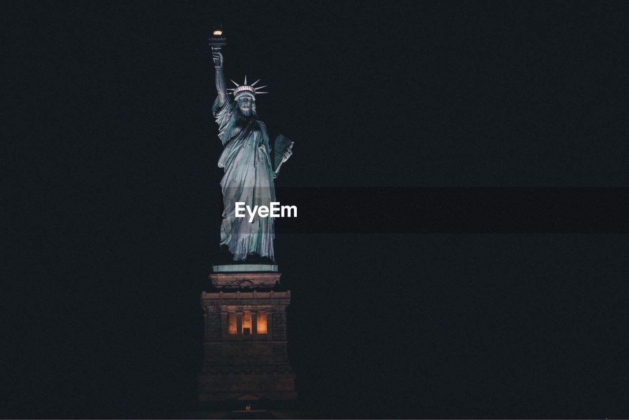 View of statue of liberty at night