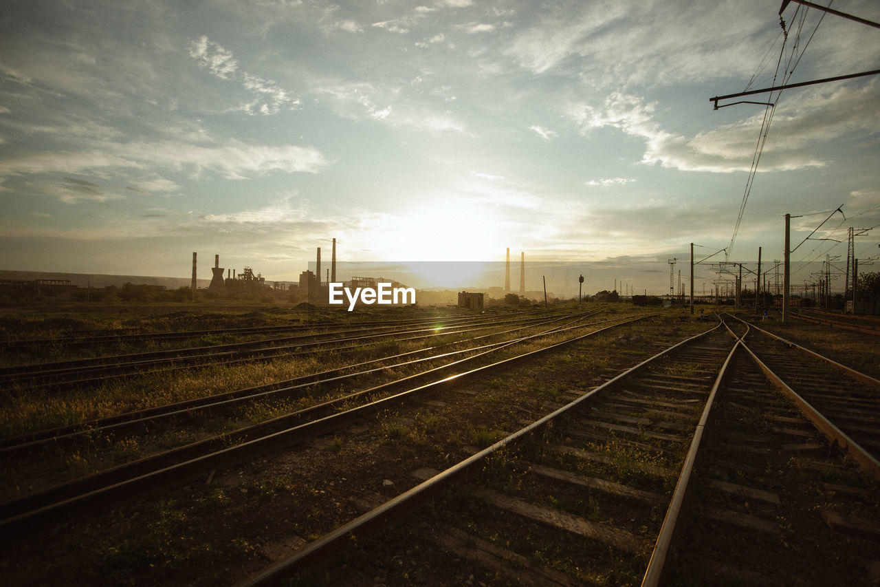 RAILROAD TRACKS AGAINST SKY