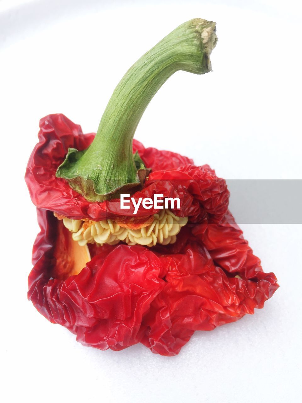 Close-up of red bell pepper against white background