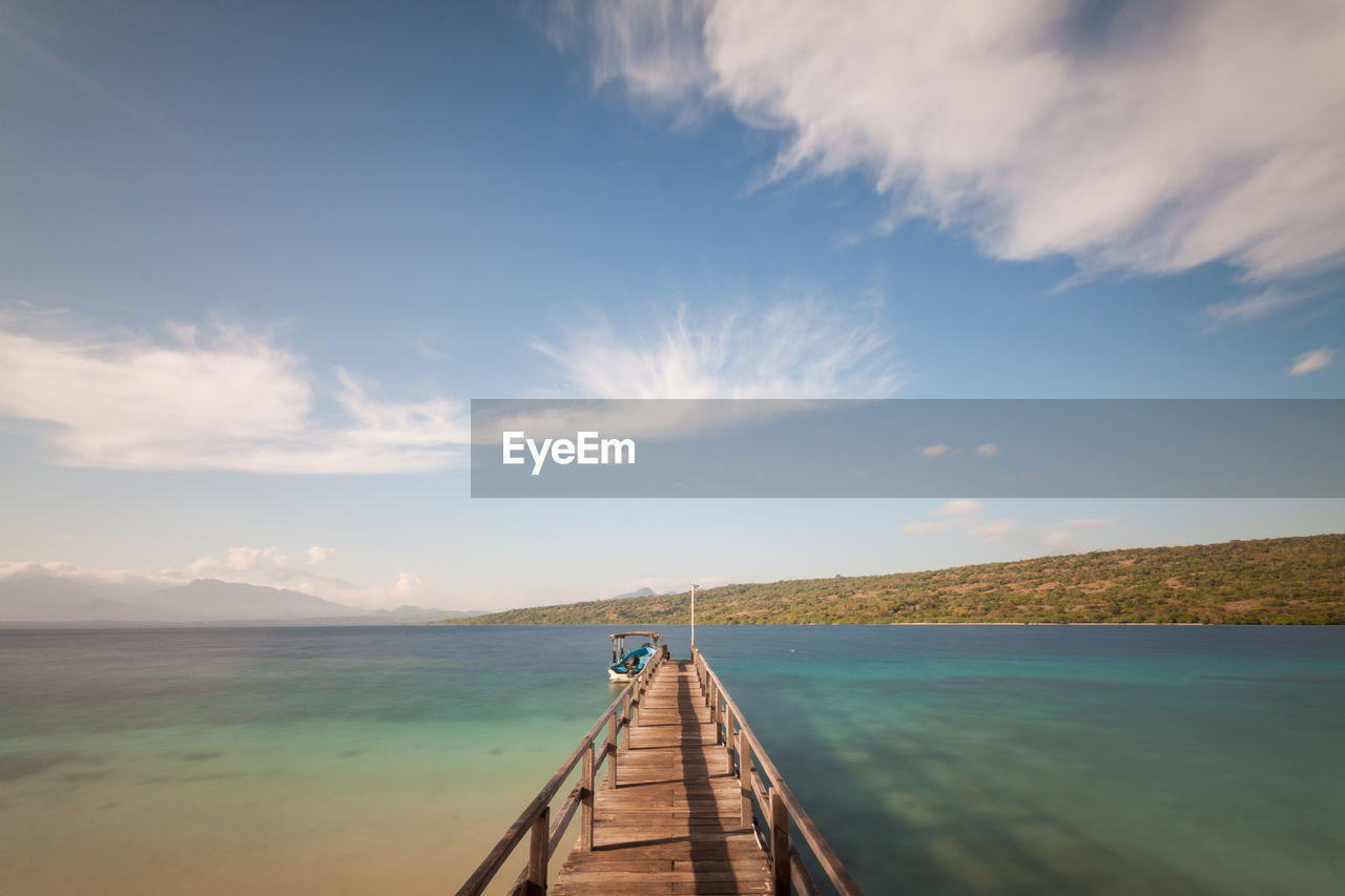 Pier over sea against sky