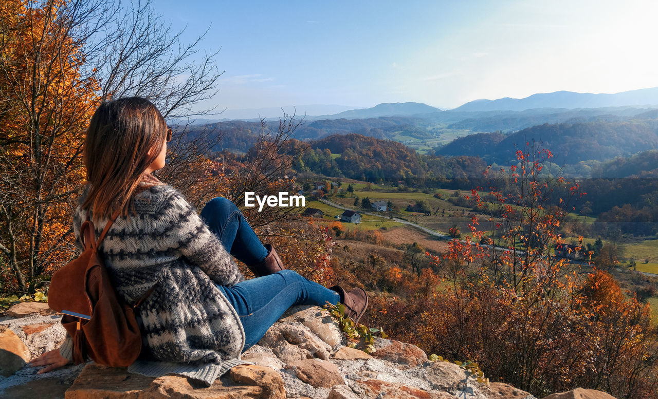 Woman looking at view of hills in autumn, fall, nature, landscape, landscape, exploring.