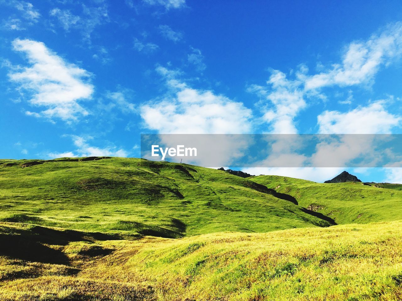 Scenic view of landscape against cloudy sky