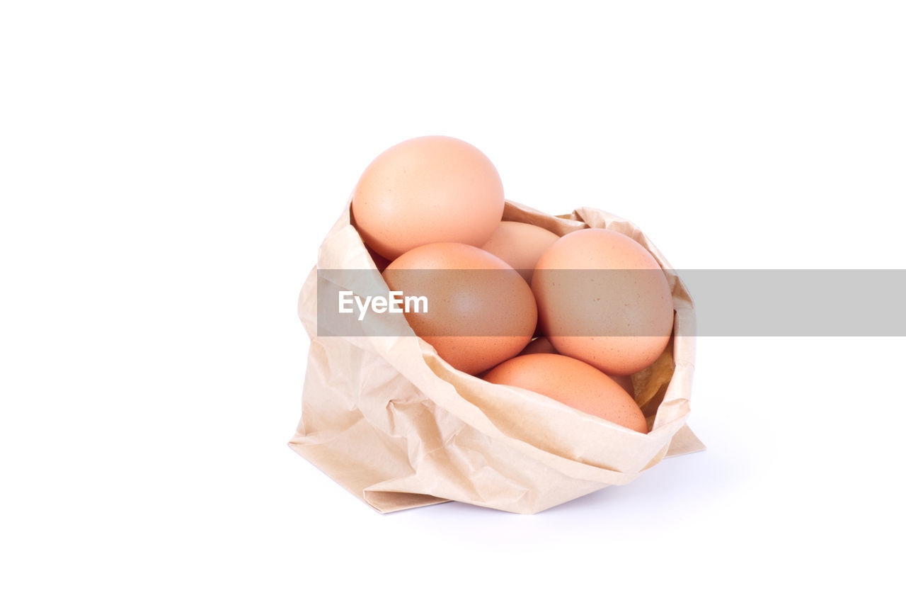 HIGH ANGLE VIEW OF EGGS IN WHITE BACKGROUND