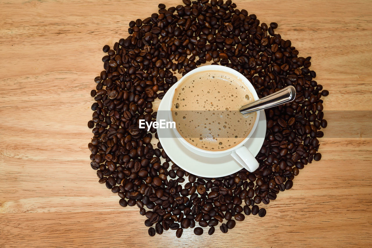 HIGH ANGLE VIEW OF COFFEE BEANS IN GLASS