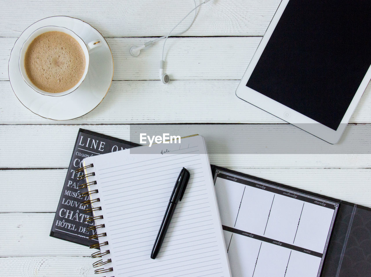 Directly above shot of coffee cup on office table