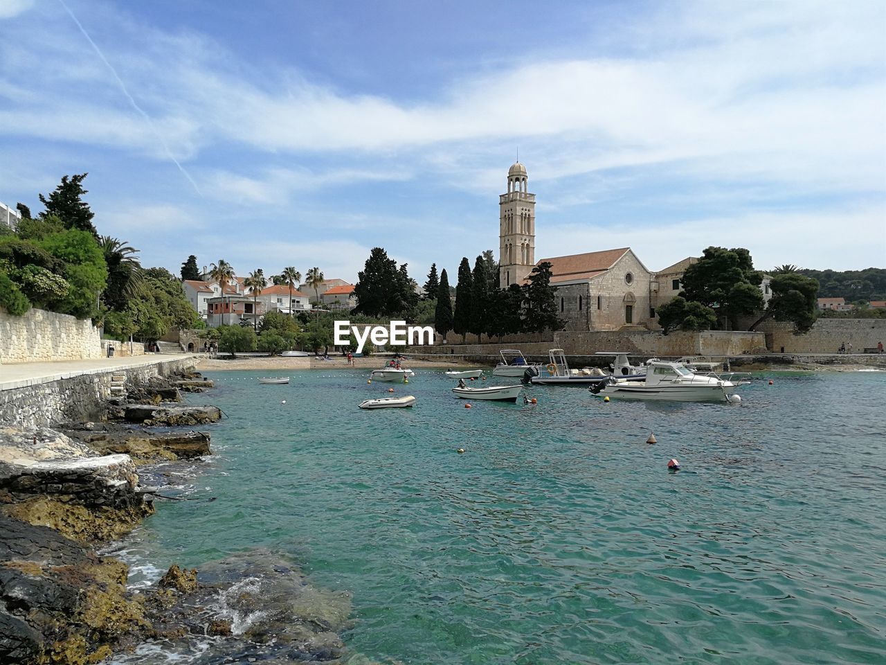Panoramic view of water and buildings against sky