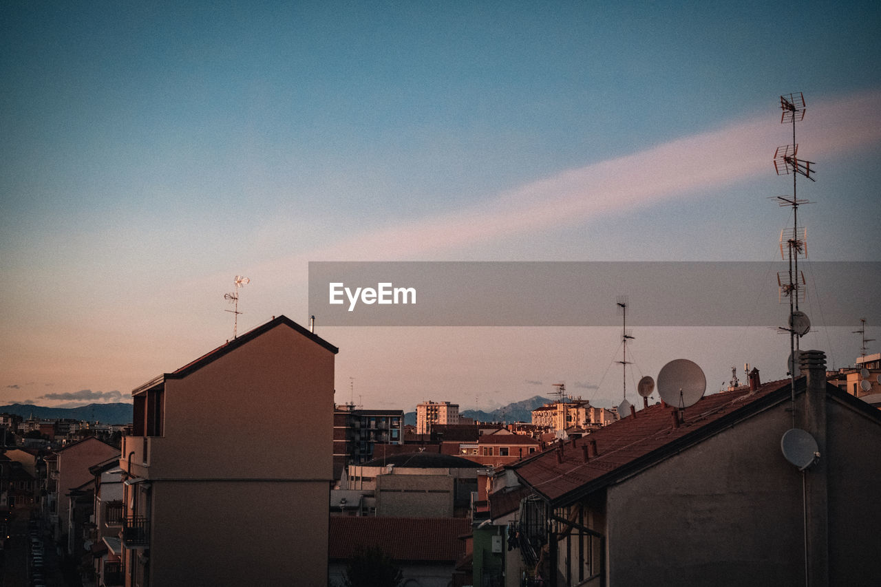 BUILDINGS AGAINST SKY DURING SUNSET