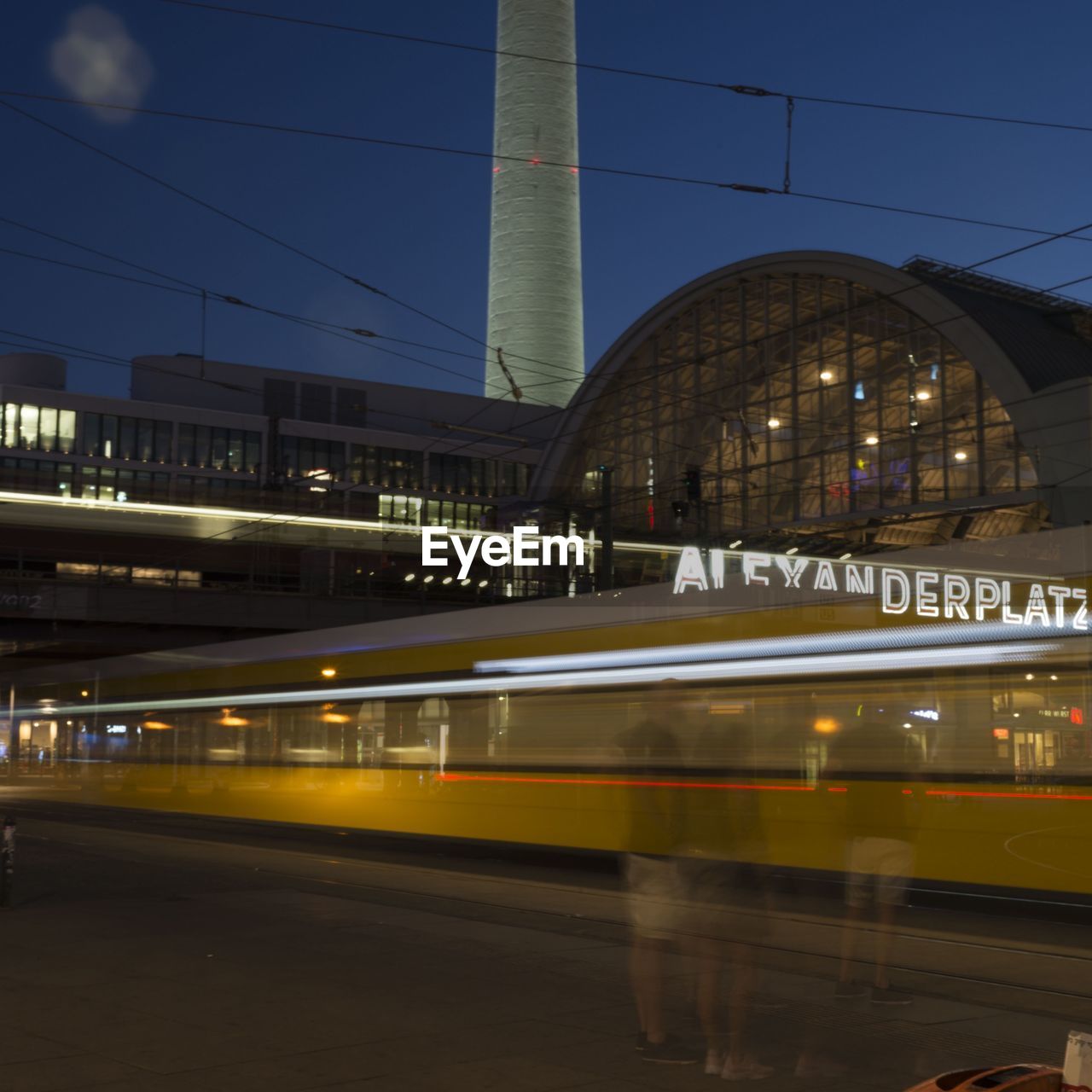 Long exposure of train at railroad station in city