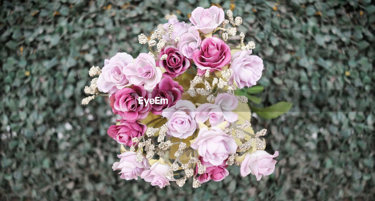 Close-up of pink rose bouquet on field