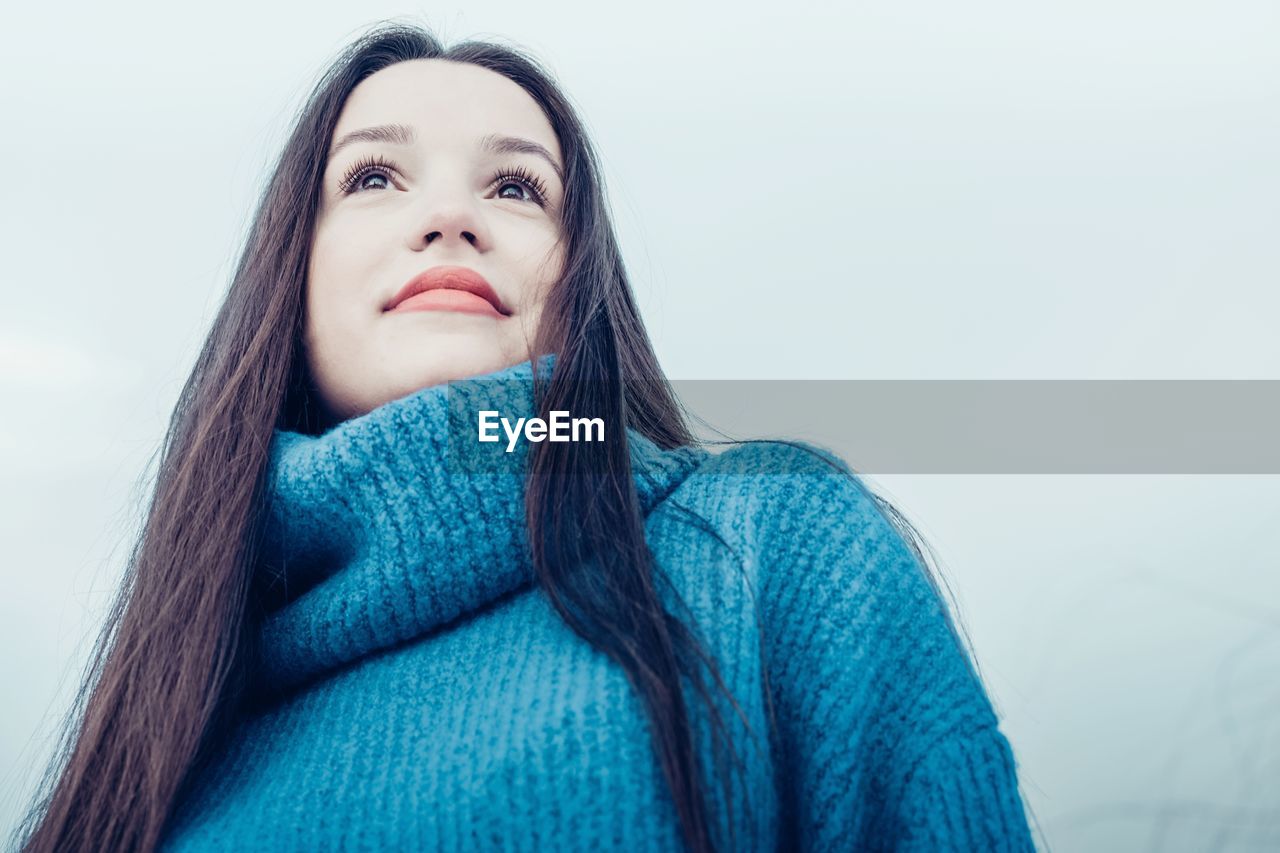 Low angle view of young woman