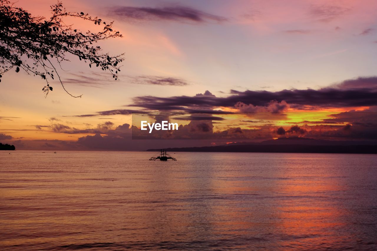 SCENIC VIEW OF SEA DURING SUNSET