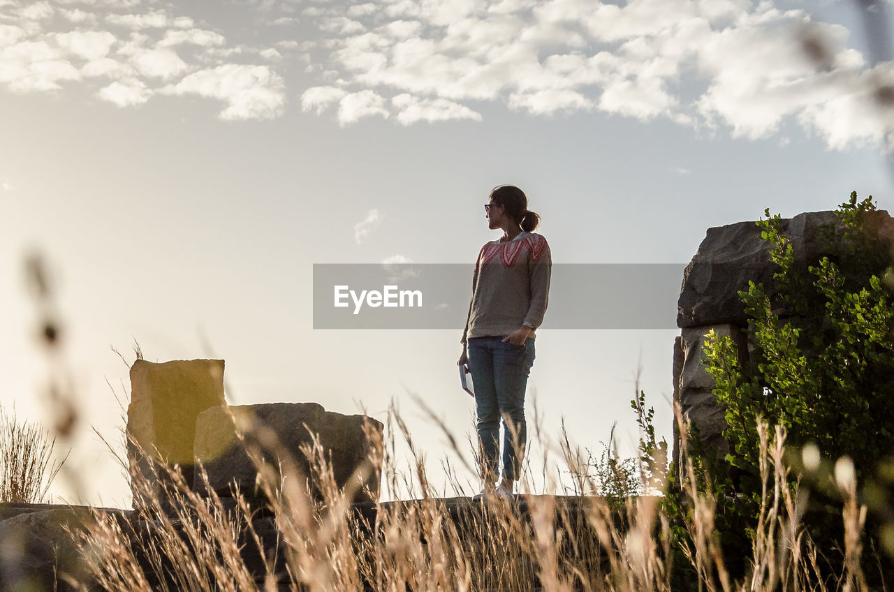 Woman standing against sky