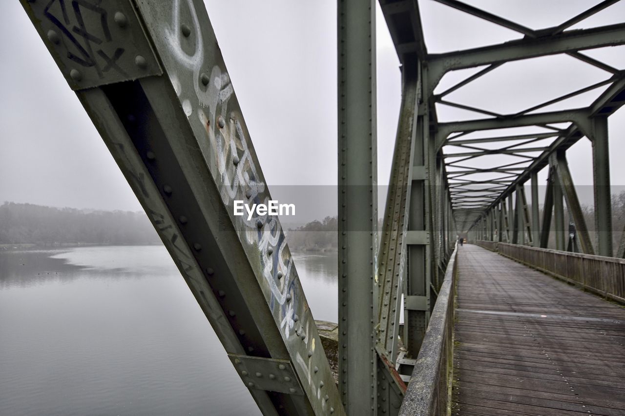bridge, architecture, water, built structure, transportation, no people, nature, sky, river, day, outdoors, fog