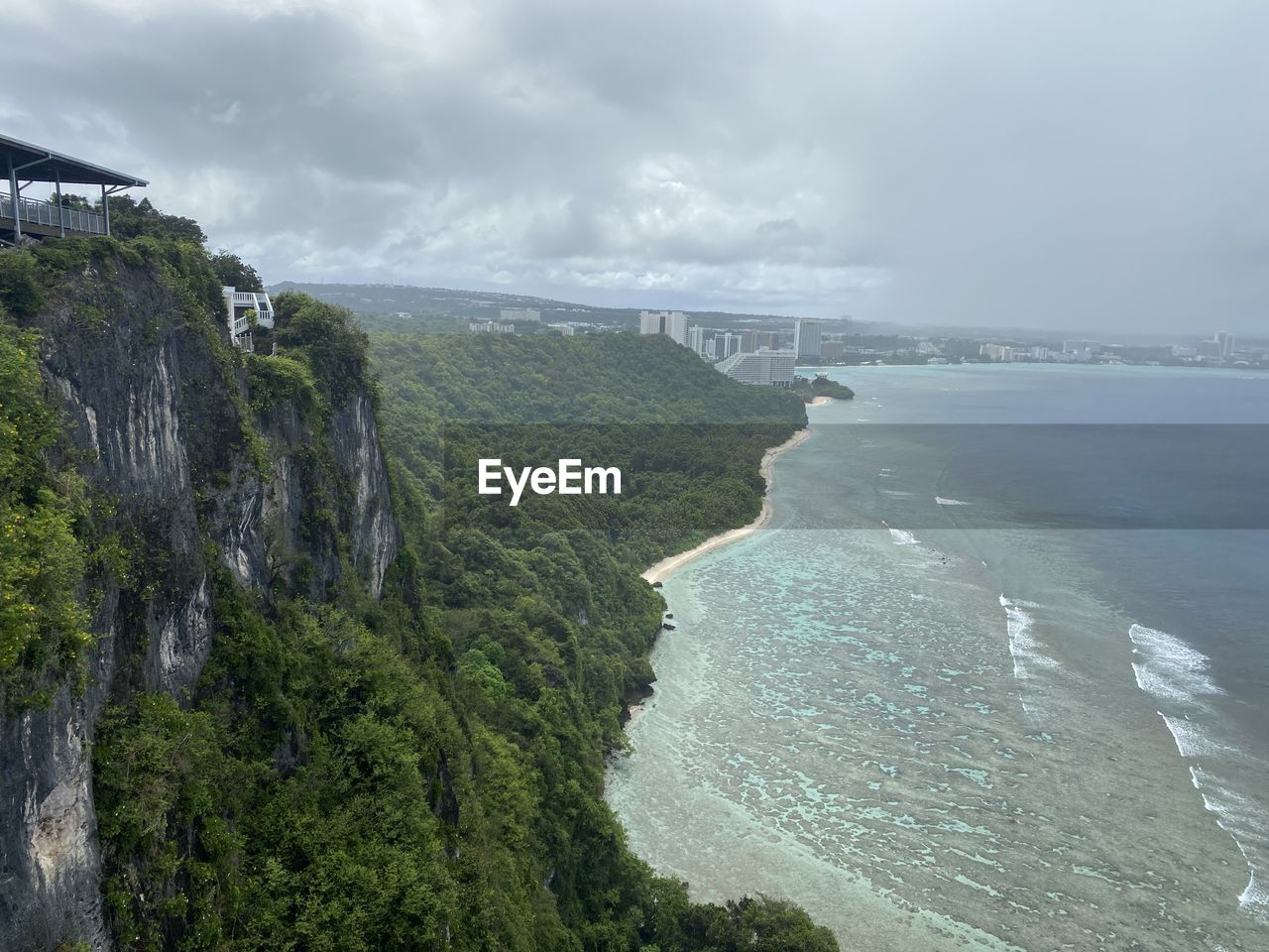 high angle view of sea and mountains against sky