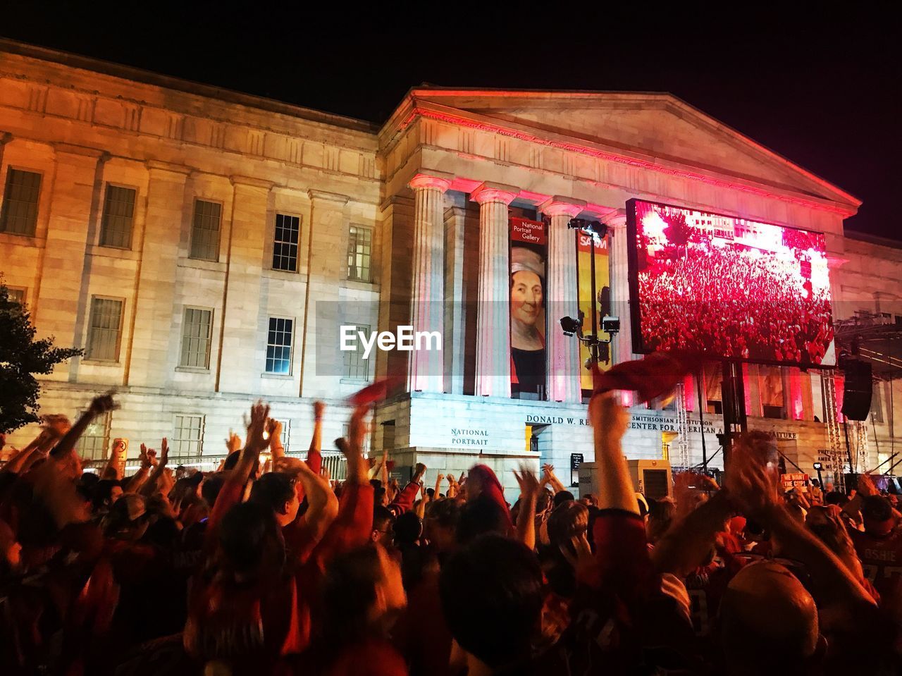 GROUP OF PEOPLE AT MUSIC CONCERT