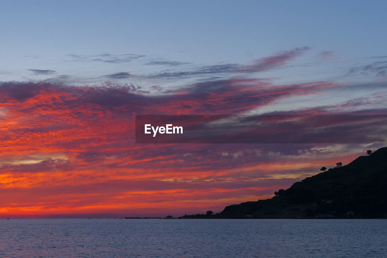 SCENIC VIEW OF SEA DURING SUNSET