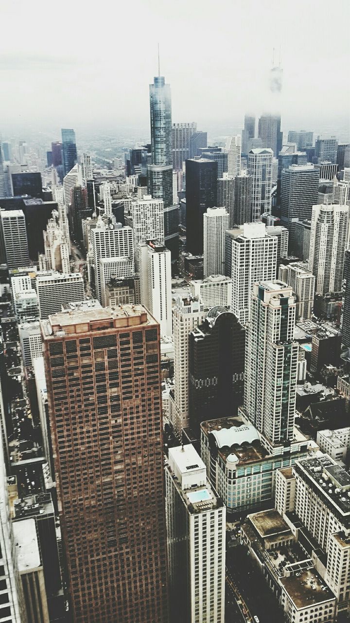 High angle view of cityscape against sky during foggy weather