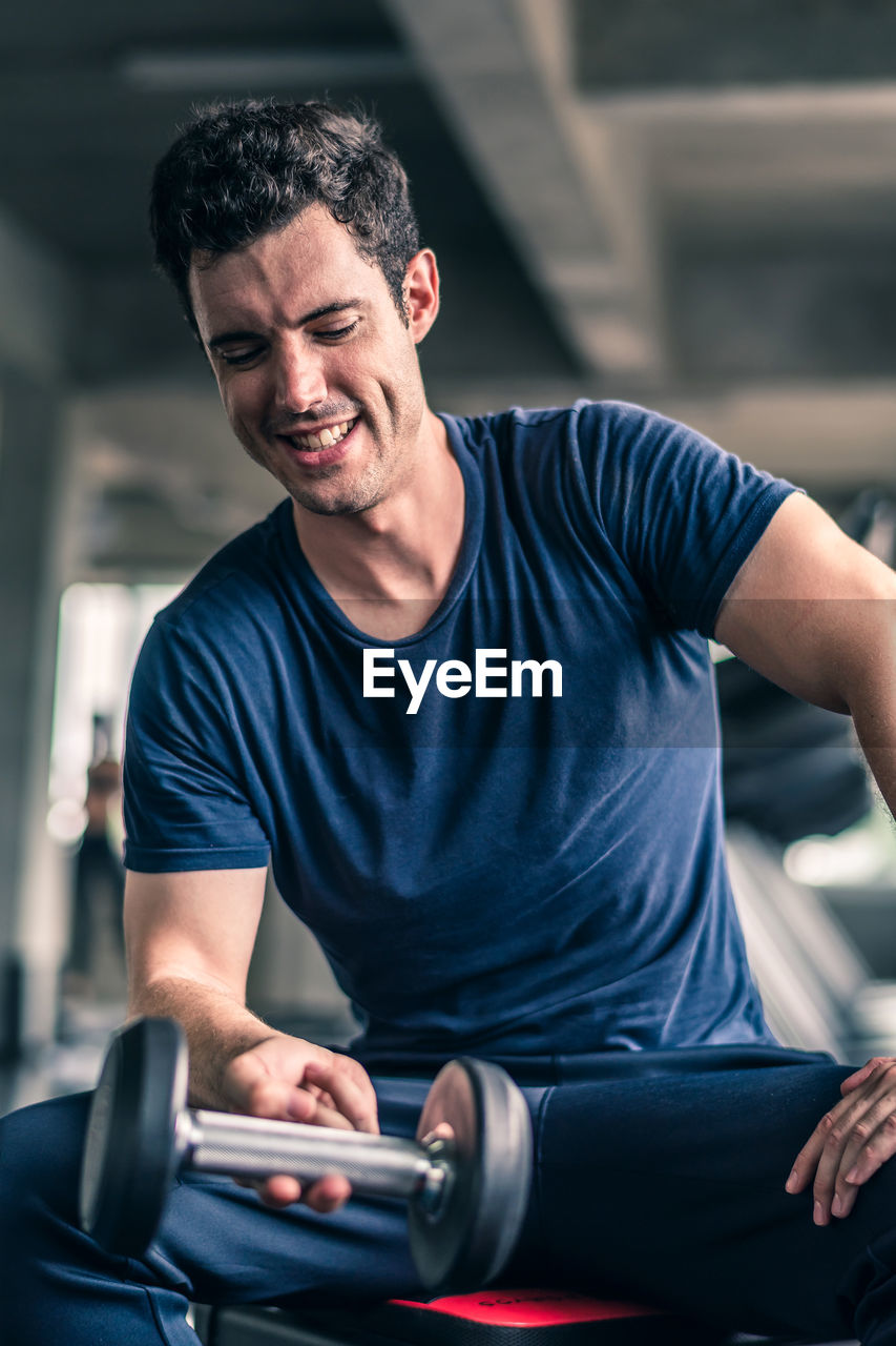 Mid adult man exercising in gym