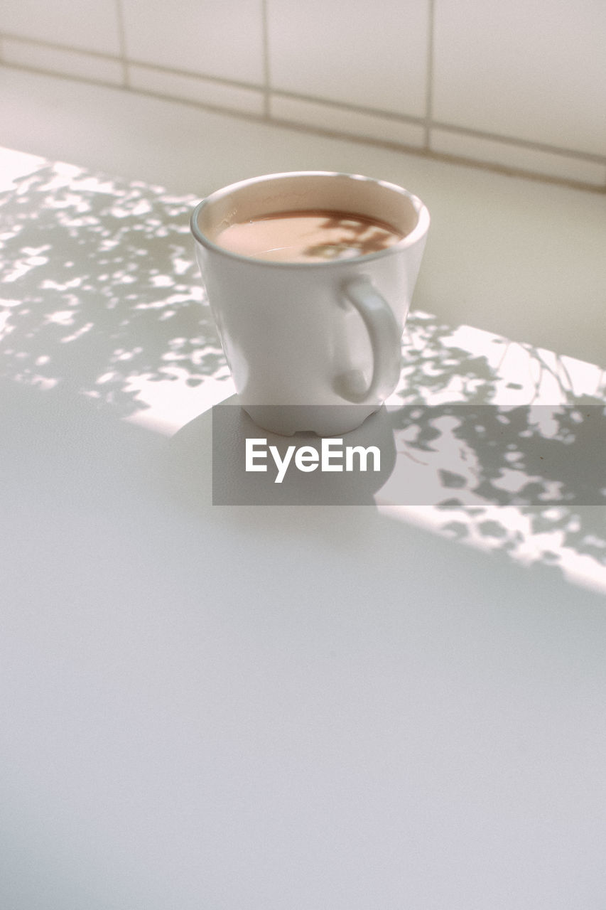 High angle view of coffee cup on table