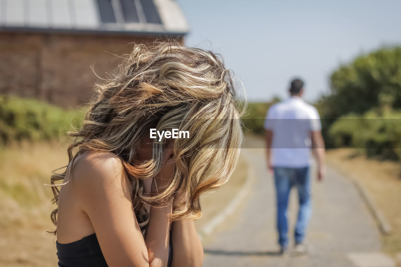 REAR VIEW OF WOMAN WITH ARMS HAIR