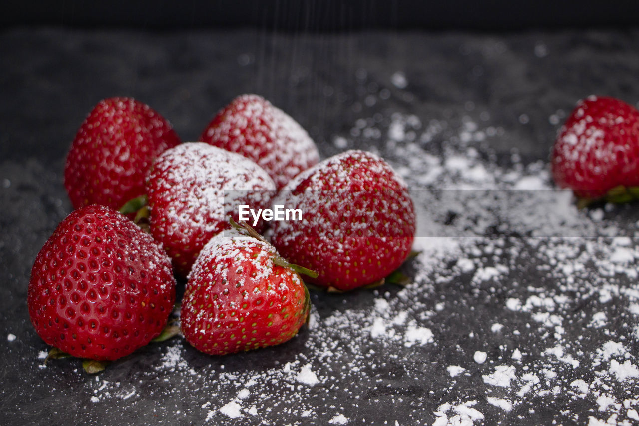 CLOSE-UP OF STRAWBERRIES IN CONTAINER