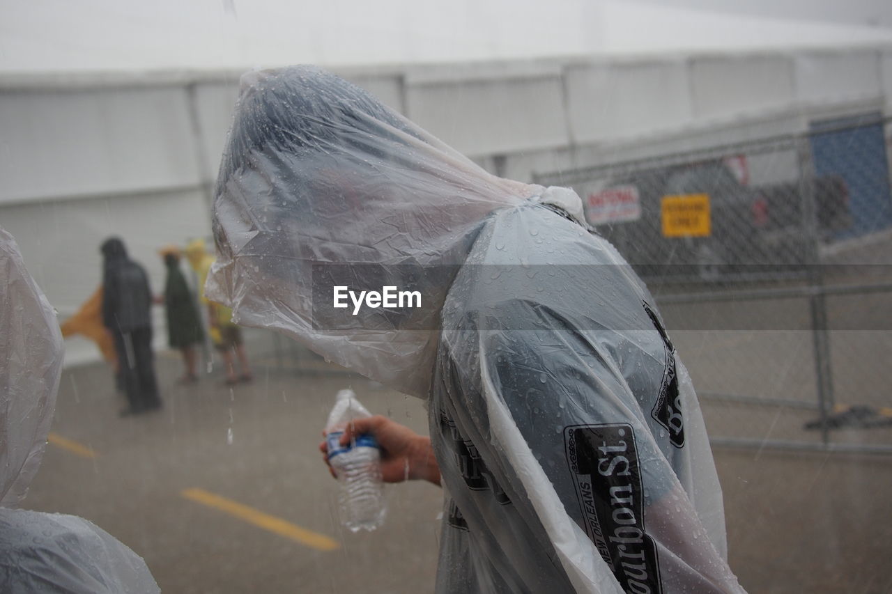 Man wearing raincoat during monsoon