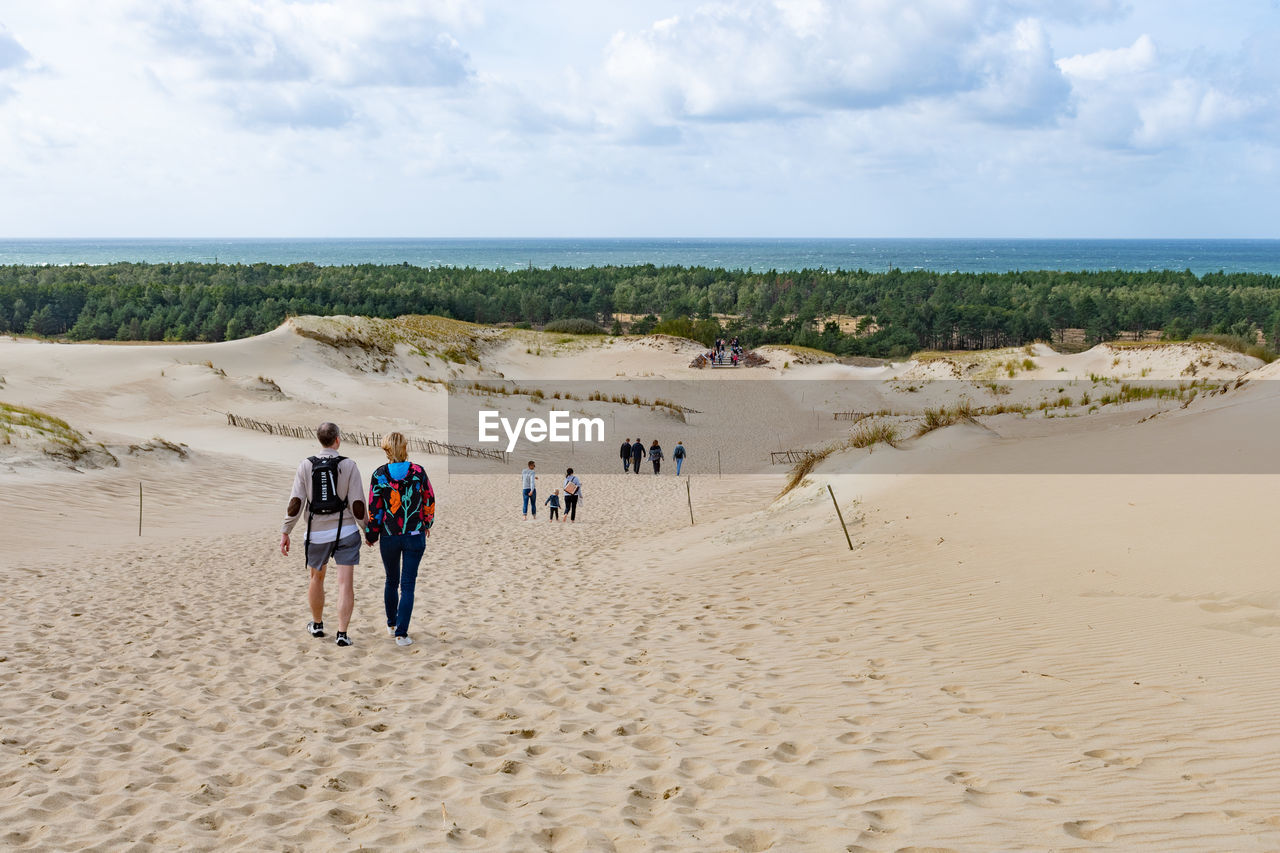 GROUP OF PEOPLE ON BEACH