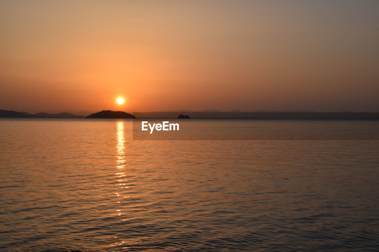 SCENIC VIEW OF SEA AGAINST ROMANTIC SKY