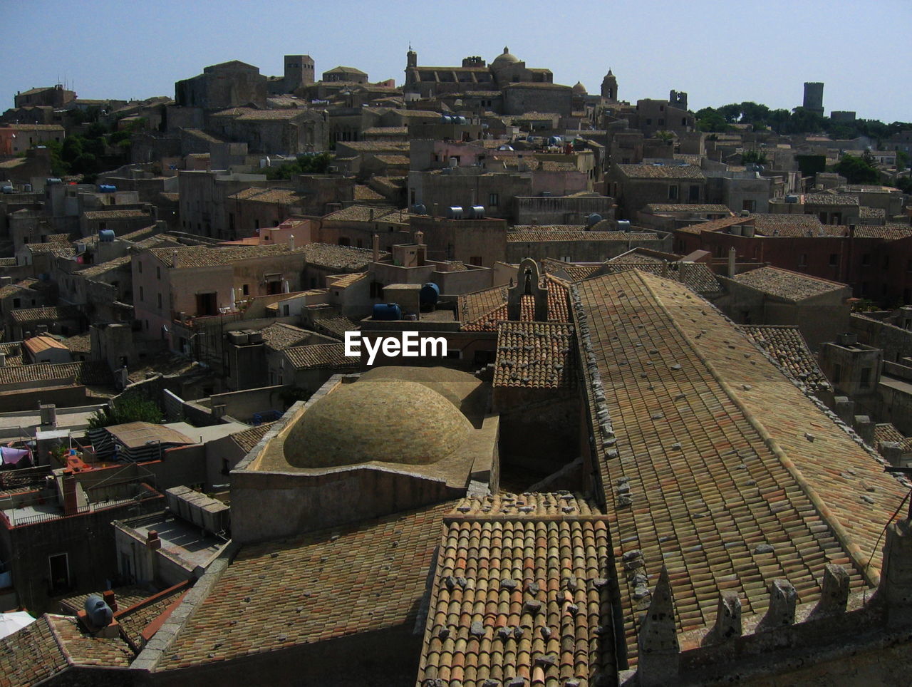 High angle view of buildings in town on sunny day