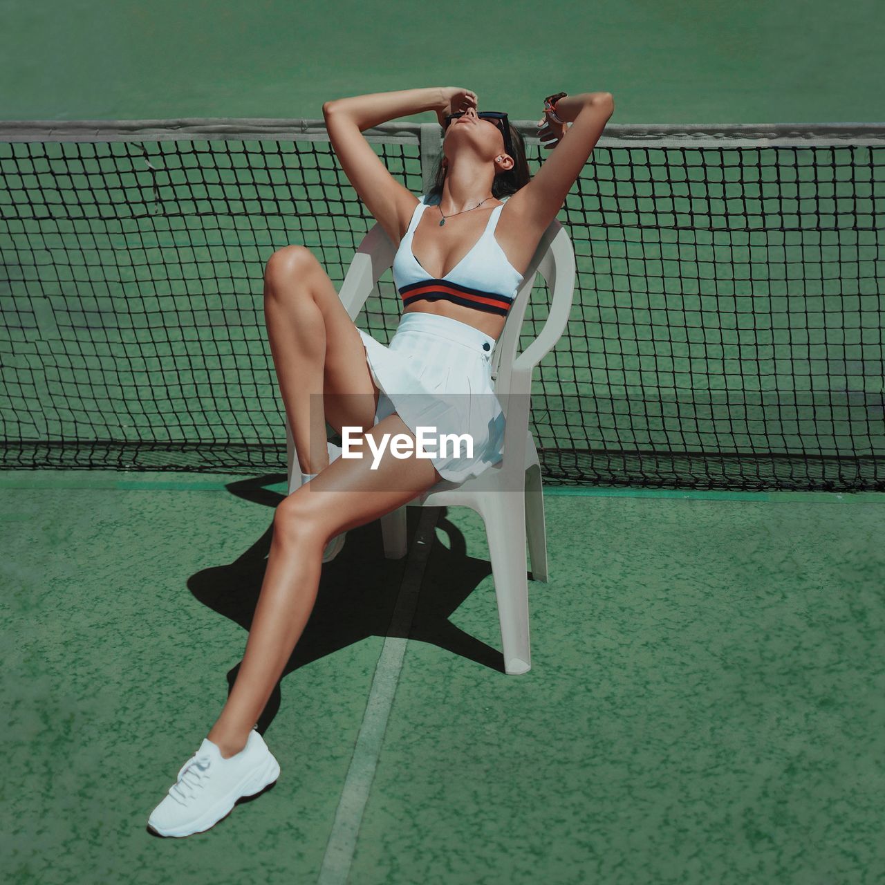 Woman relaxing on swimming pool