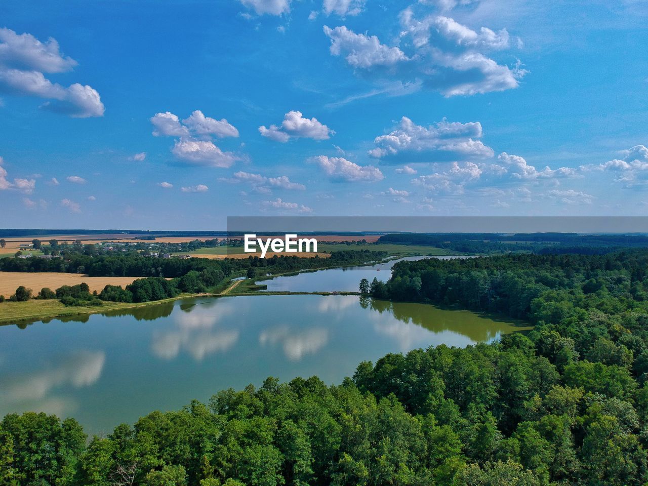 SCENIC VIEW OF TREES AND LAKE AGAINST SKY