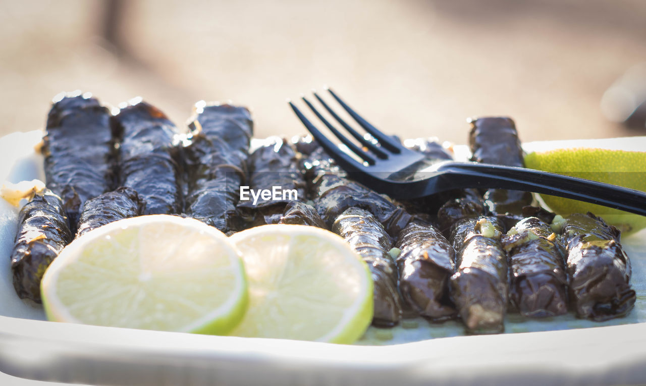 Close-up of grape leaves on table