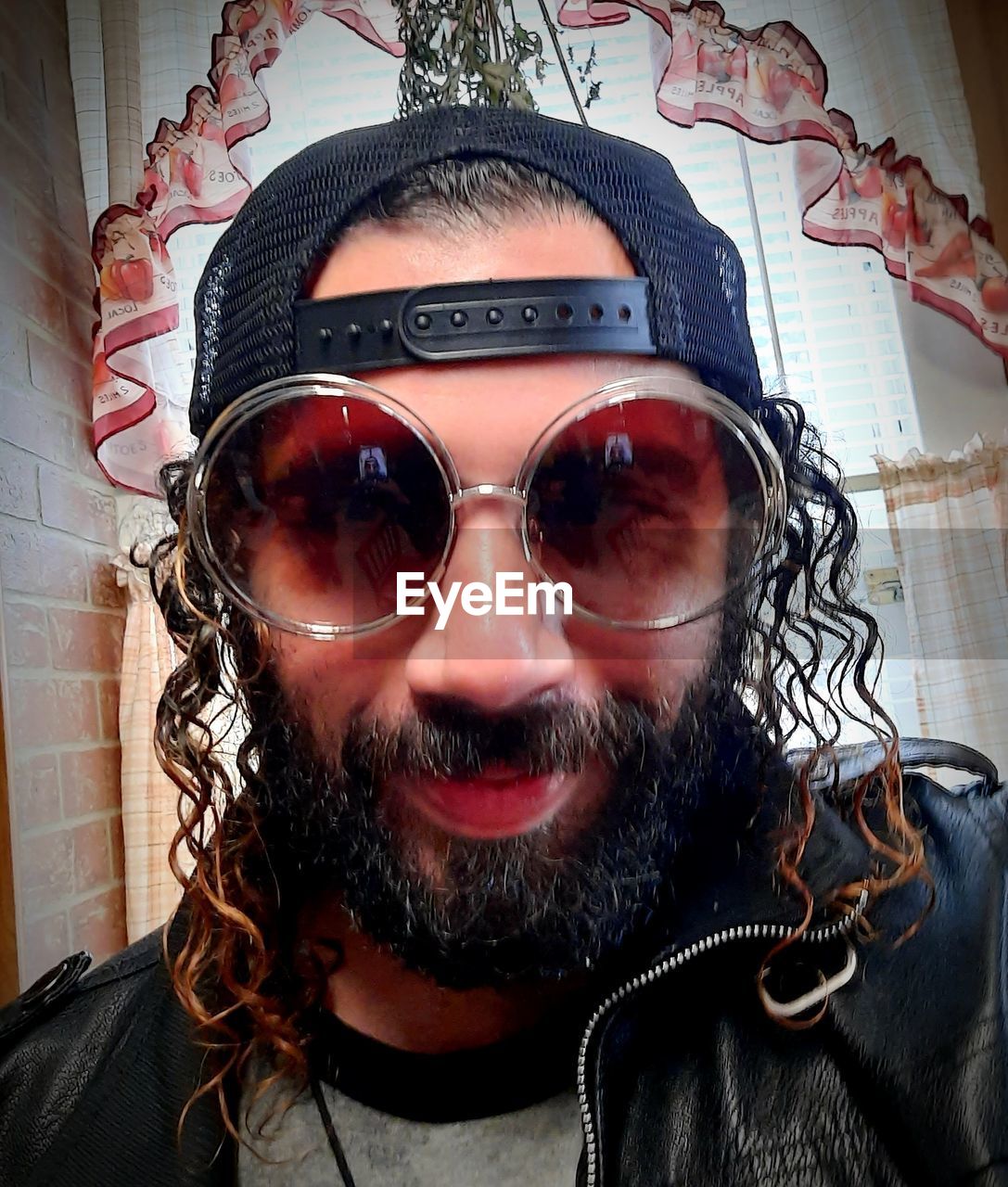 portrait, human hair, one person, facial hair, beard, glasses, fashion, hairstyle, headshot, front view, sunglasses, adult, men, looking at camera, vision care, lifestyles, moustache, clothing, indoors, human face, cool, person, leisure activity, close-up, human head, young adult, goggles