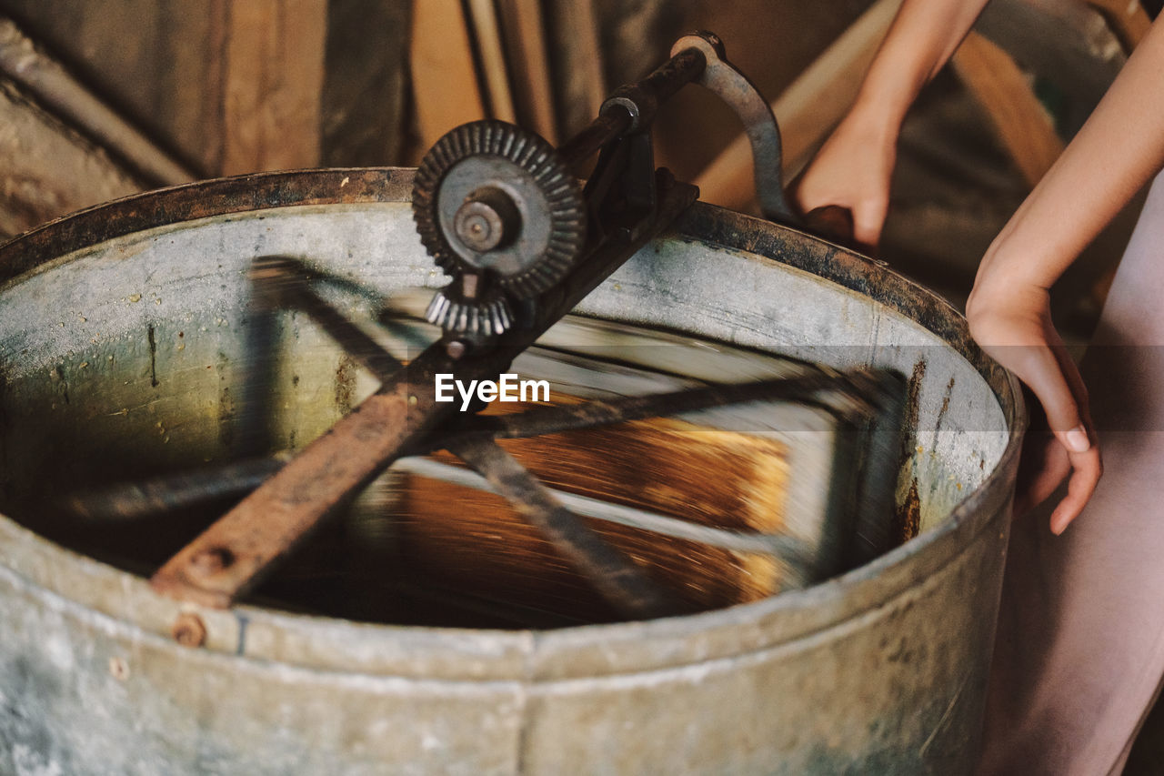 The process of extracting honey from bee honeycombs