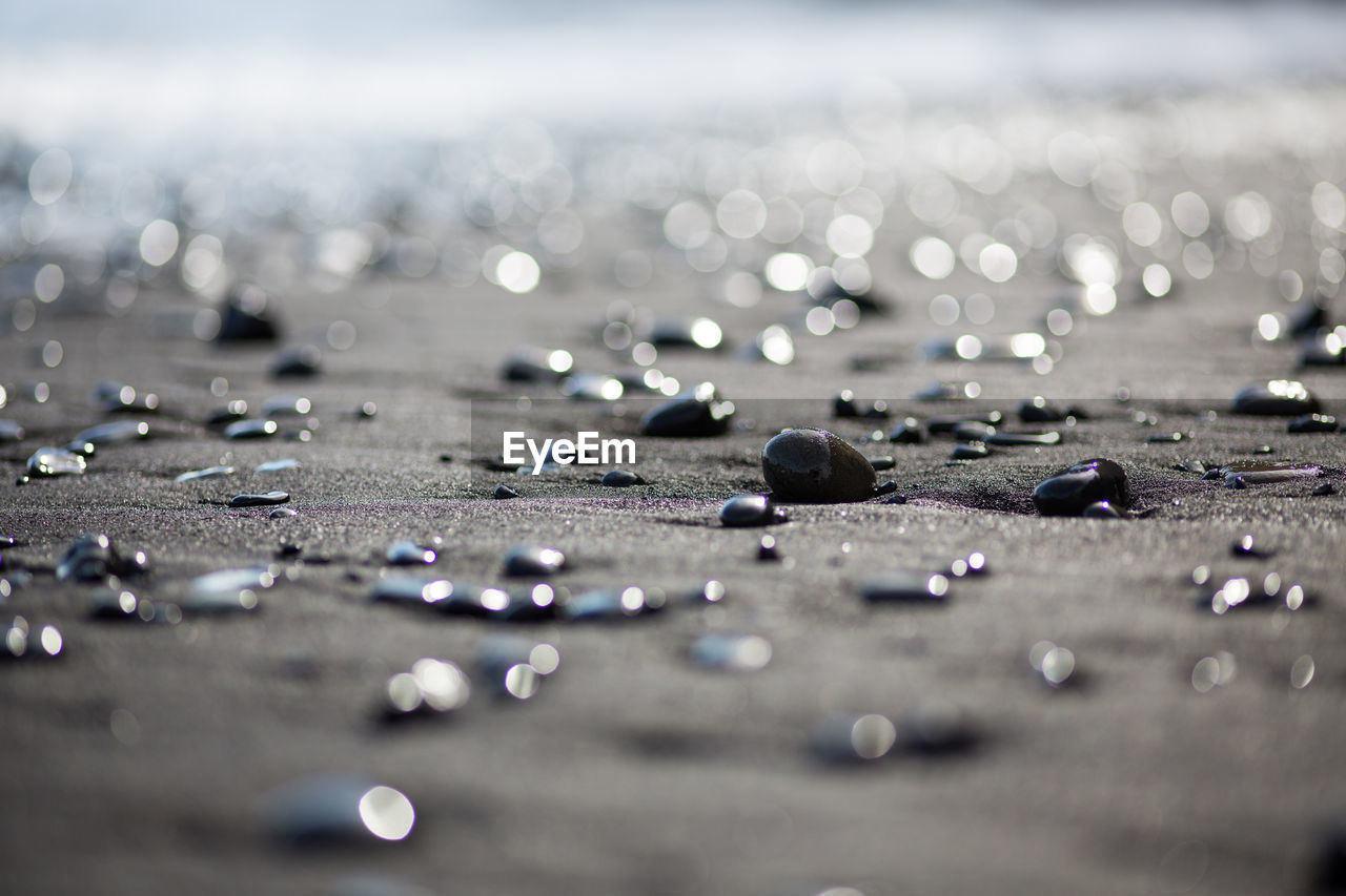 Surface level of wet pebbles at beach