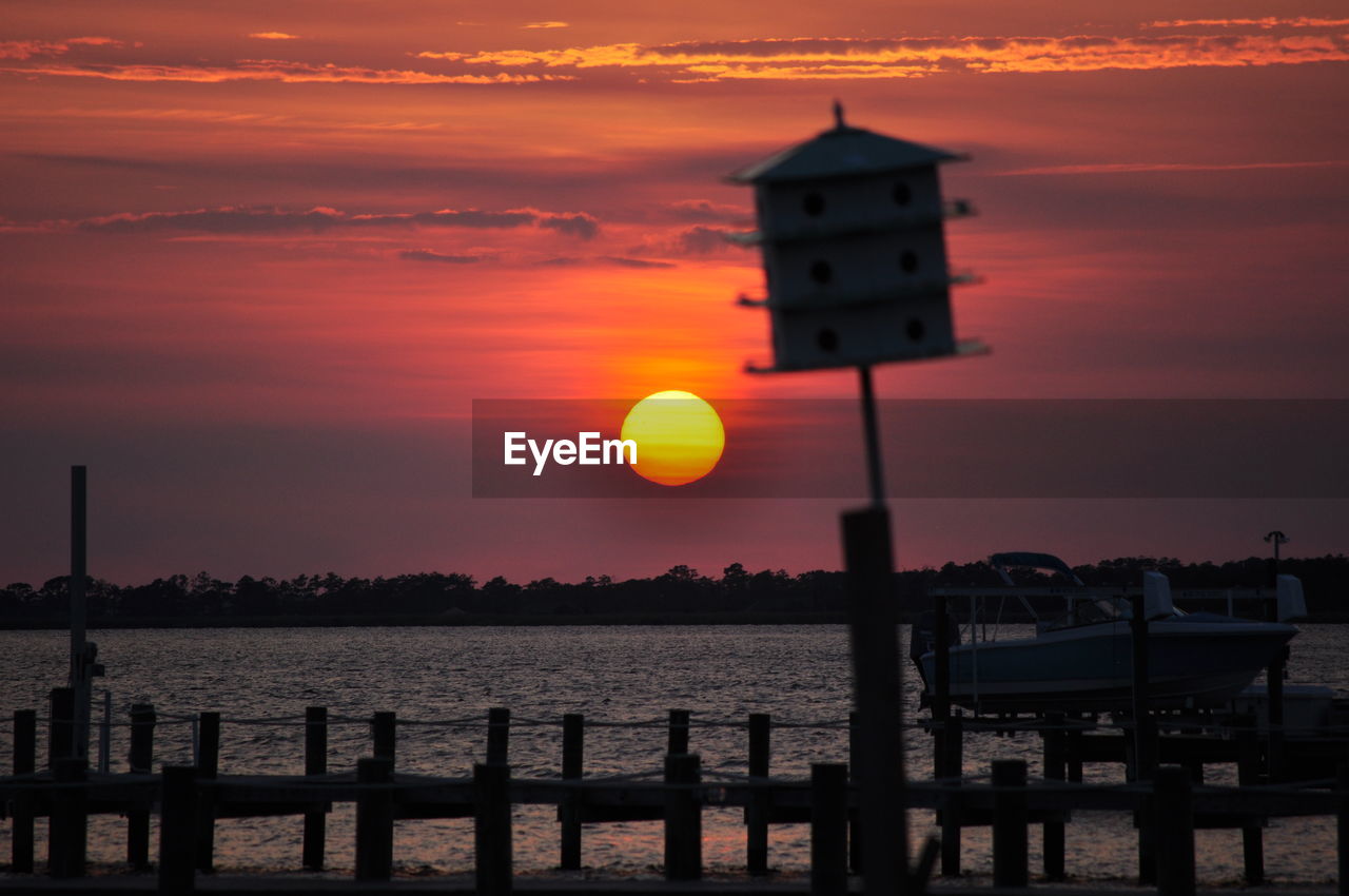 Scenic view of sea against orange sky