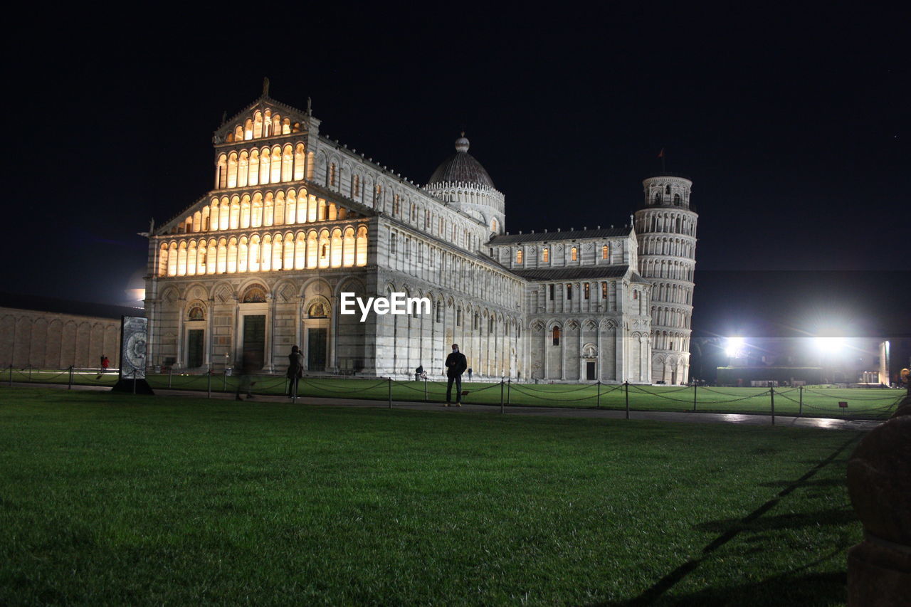 Piazza miracoli in pisa at night anmonuments as the tower and solitude of global pandemic in tuscany