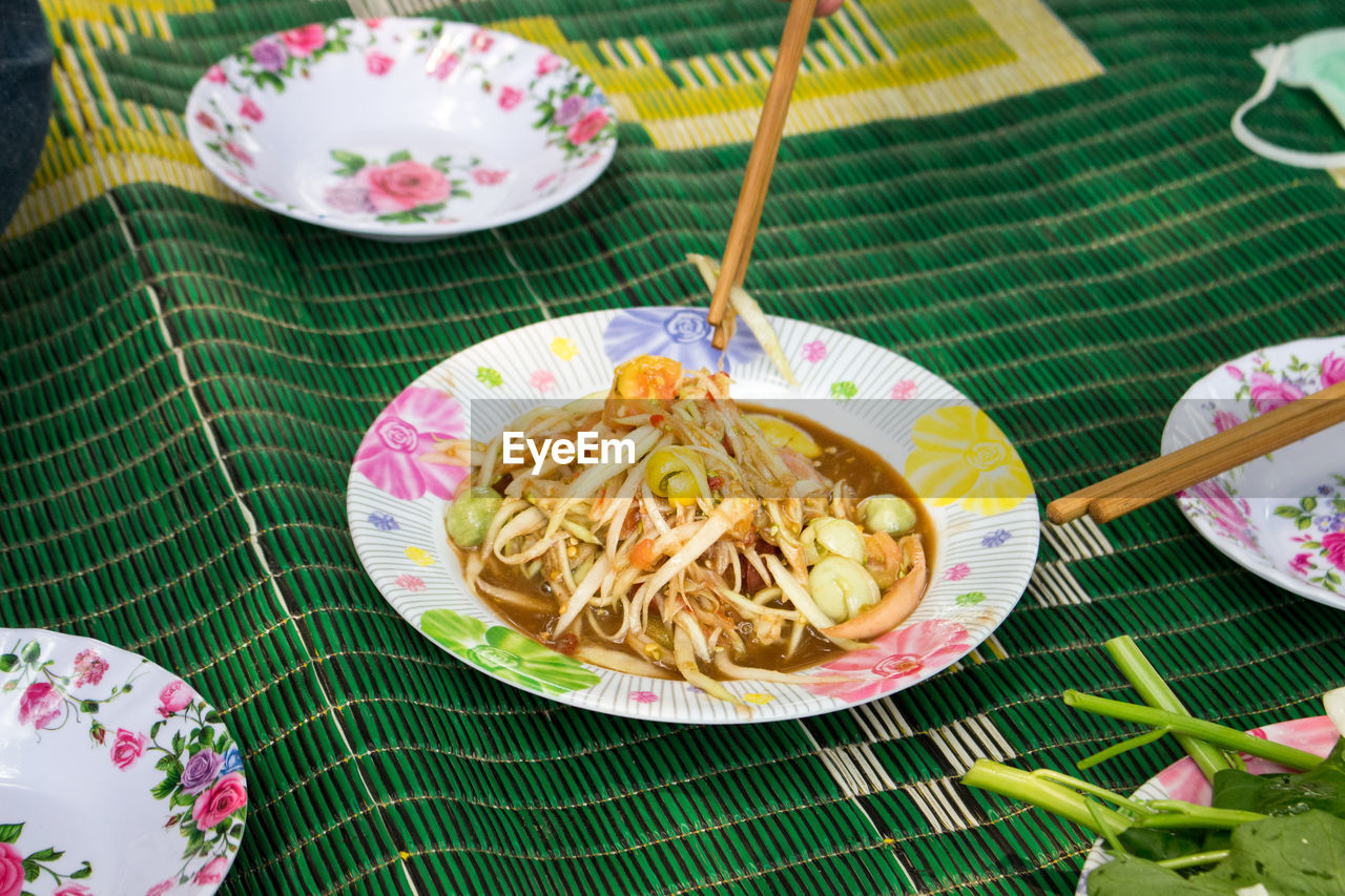 High angle view of food in plate on carpet