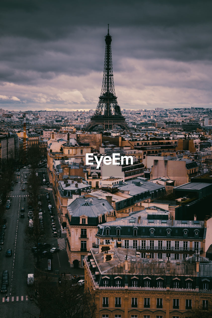 VIEW OF CITYSCAPE AGAINST CLOUDY SKY