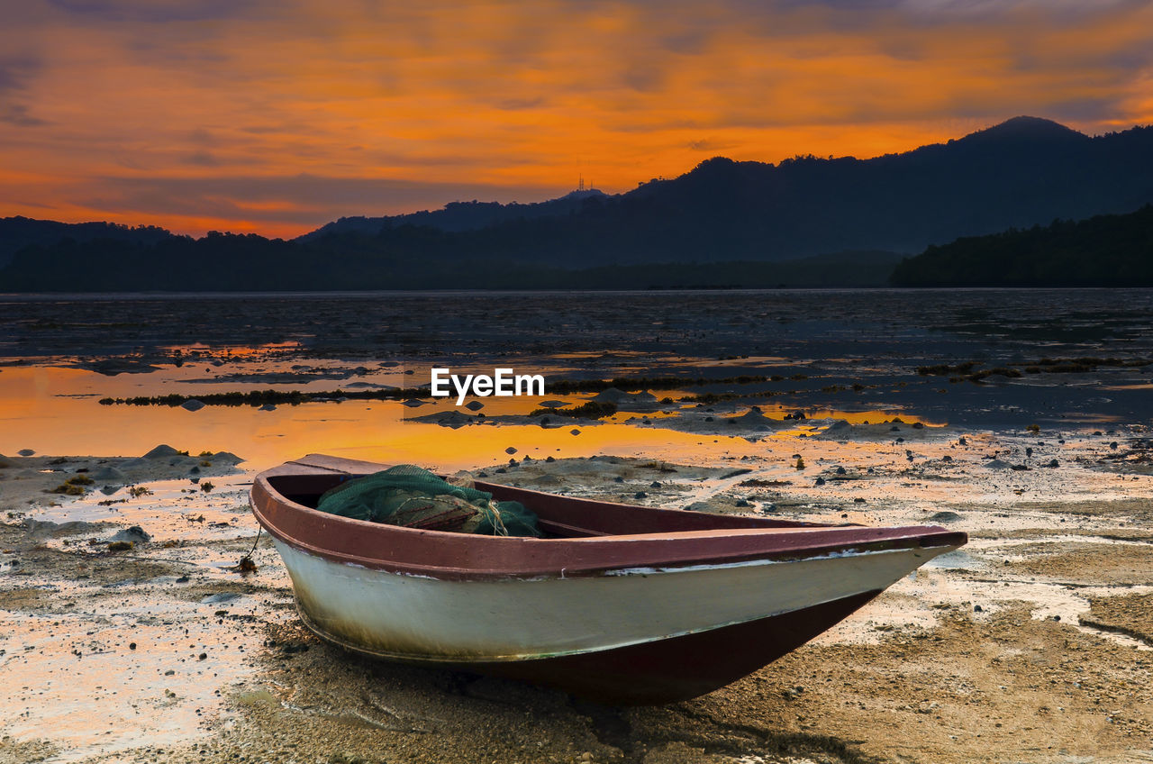 Scenic view of beach against sky during sunset