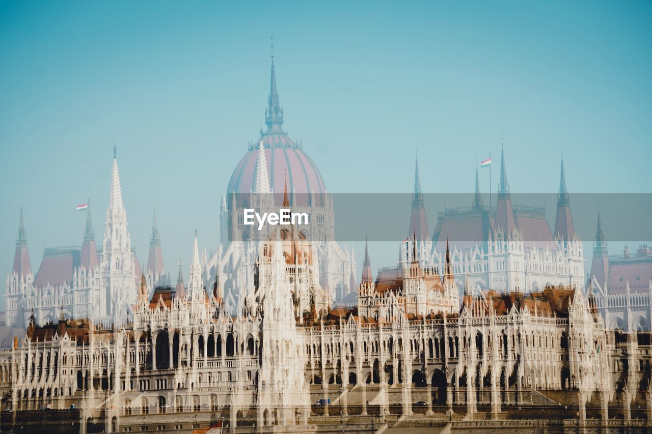 Double exposure of hungarian parliament building and church
