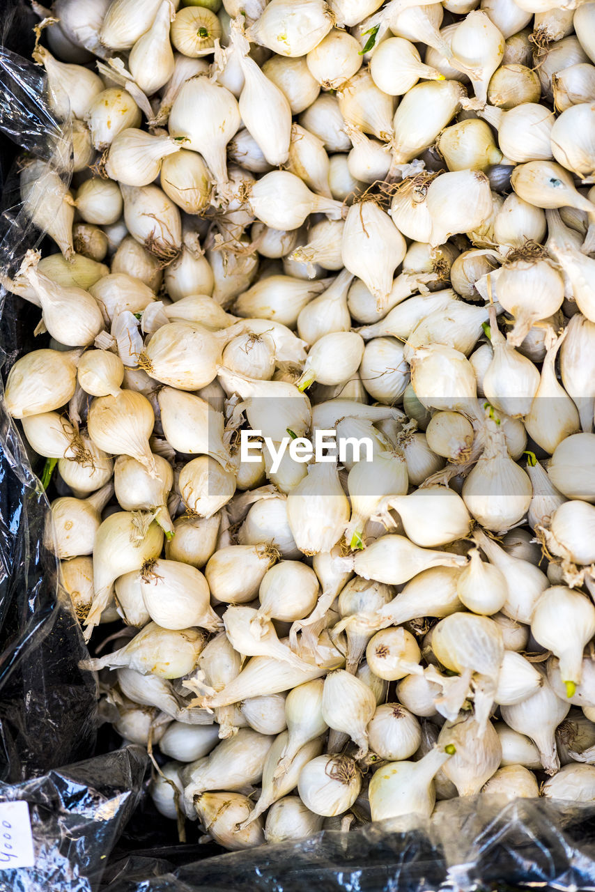 High angle view of garlic for sale at market stall