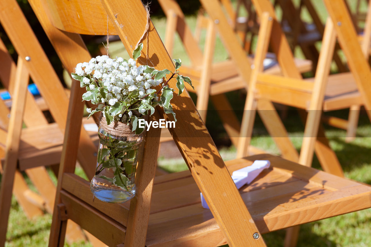 HIGH ANGLE VIEW OF POTTED PLANTS ON TABLE AT SIDEWALK