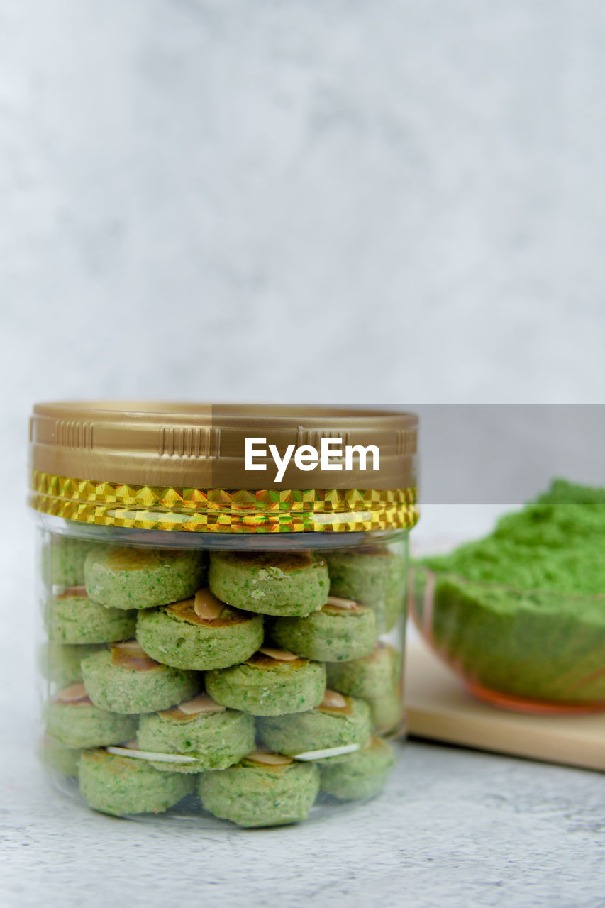 Biskut mazola kacang hijau is a green peas cookies with background decoration