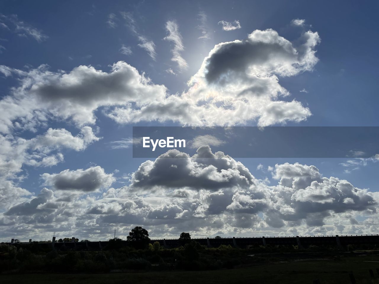 sky, cloud, environment, horizon, nature, landscape, beauty in nature, scenics - nature, no people, sunlight, blue, cloudscape, outdoors, land, day, tranquility, storm, dramatic sky, plant, dusk, plain, tree, tranquil scene