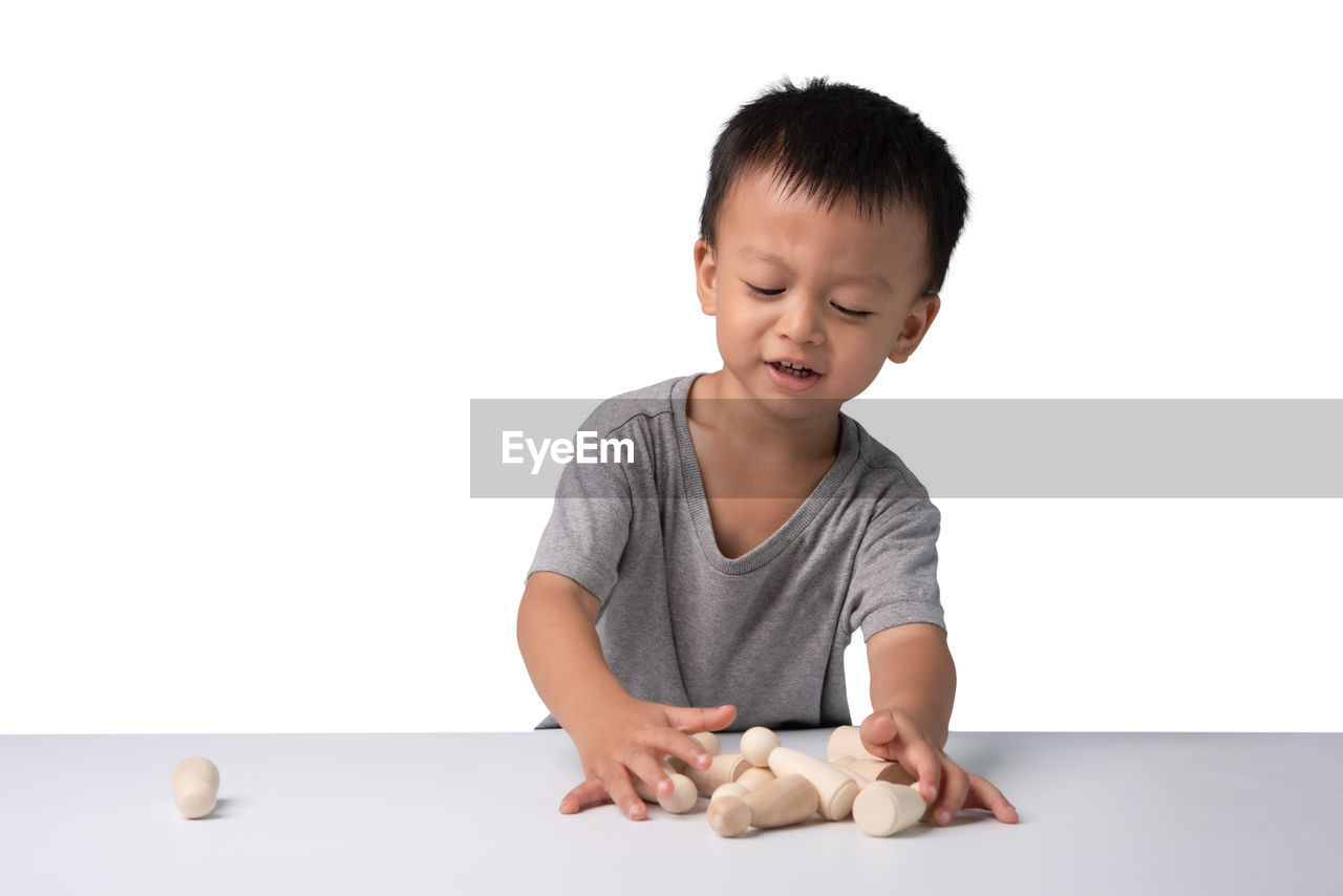 BOY PLAYING WITH BABY