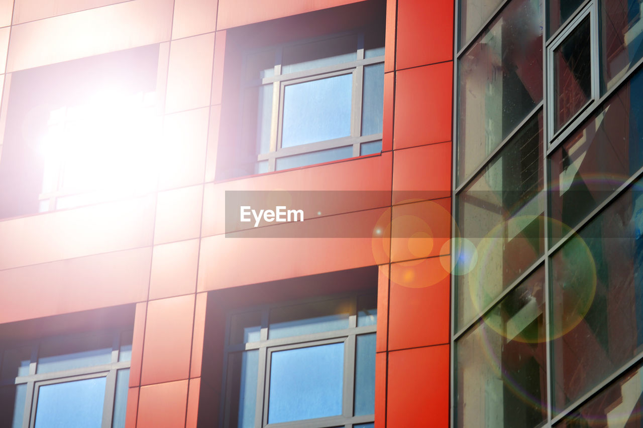 Red, blue color walls of a modern building. part of the facade of the building in the style 