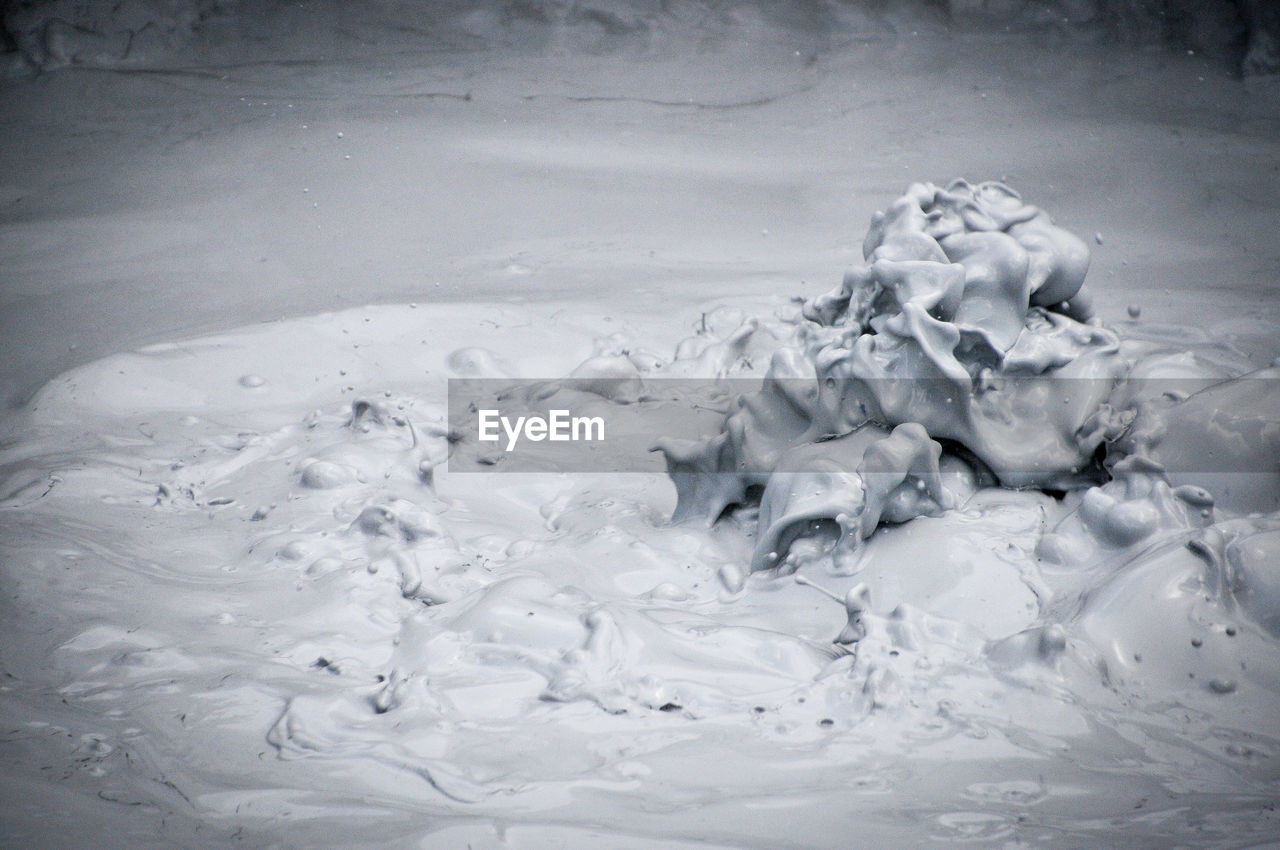 HIGH ANGLE VIEW OF FROZEN SEA SHORE