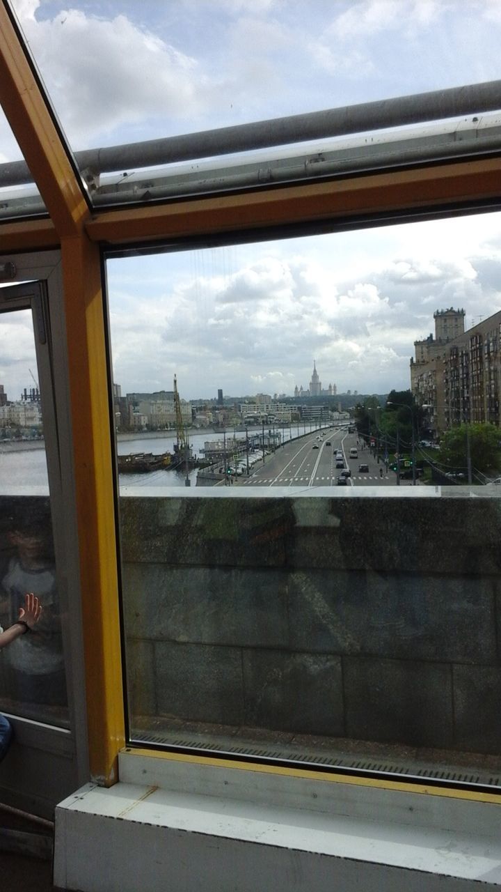 VIEW OF BUILT STRUCTURES AGAINST CLOUDY SKY