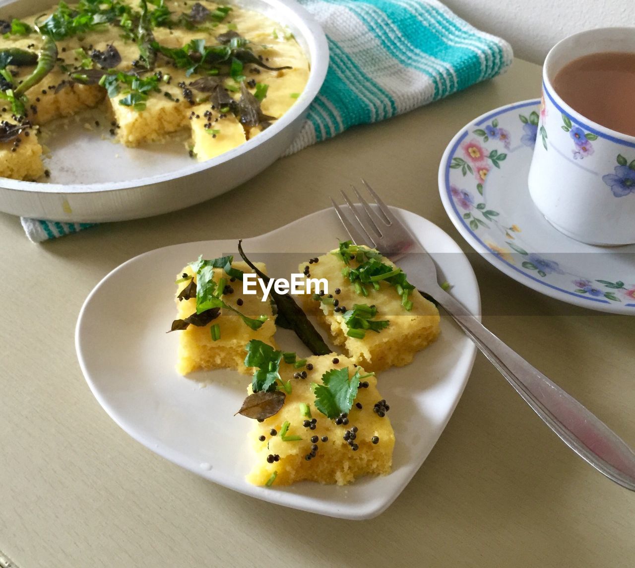 High angle view of food and tea served on table